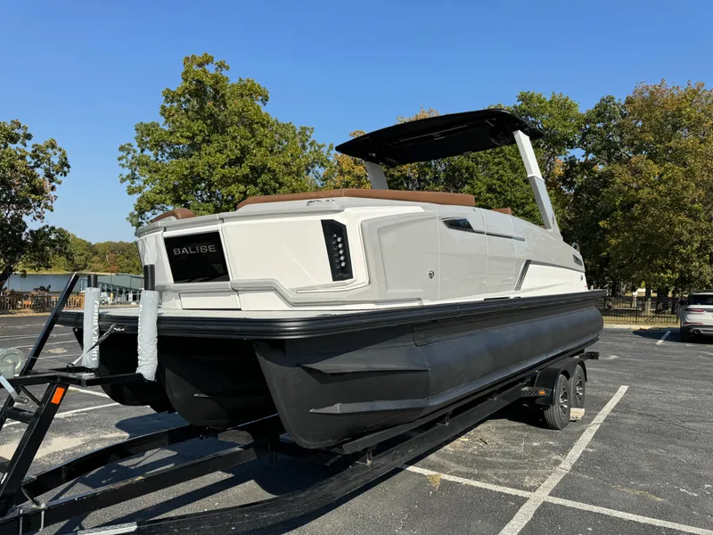 The Image of 2025 Balise Helix 24L boat on trailer, parked outdoors, clear sky. - 0
