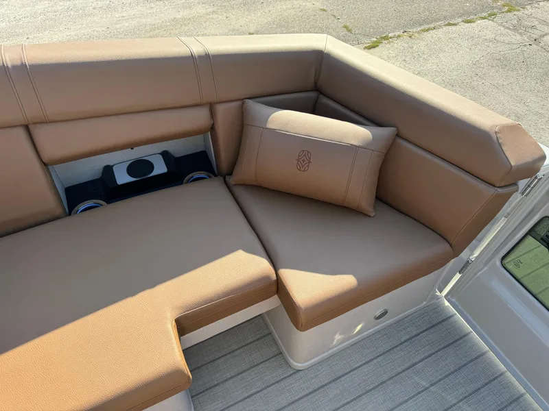 Slide: The Image of Luxurious seating on 2025 Balise Helix 24L boat with tan upholstery and cushion. - 17
