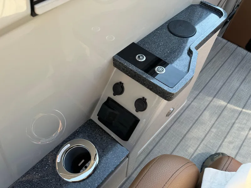 Slide: The Image of Interior of 2025 Balise Helix 24L with modern control panel and cup holder. - 20