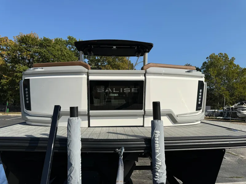 Slide: The Image of 2025 Balise Helix 24L boat on trailer, rear view, outdoors. - 3