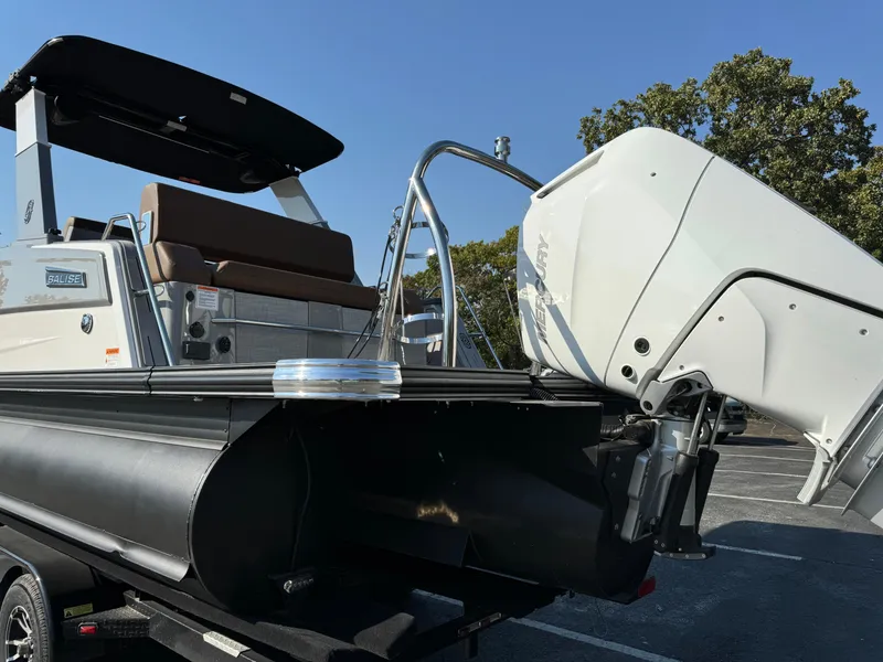 Slide: The Image of Balise Helix 24L 2025 boat with outboard motor, parked on a trailer. - 5