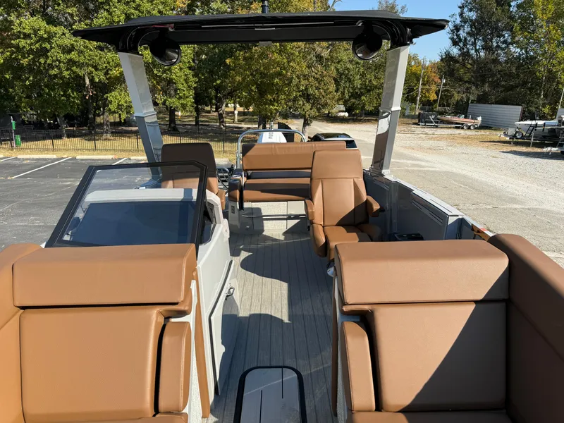 Slide: The Image of Balise Helix 24L boat interior, 2025 model, featuring brown seating and modern design. - 6