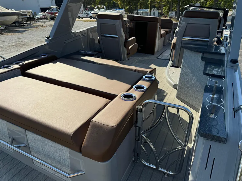 Slide: The Image of Luxury interior of 2025 Balise Helix 24L boat with seating and cup holders. - 9