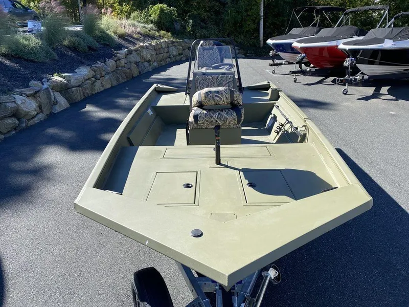 Slide: The Image of 2025 Lund 1870 Predator Z1870C Center Console boat in a parking lot. - 12