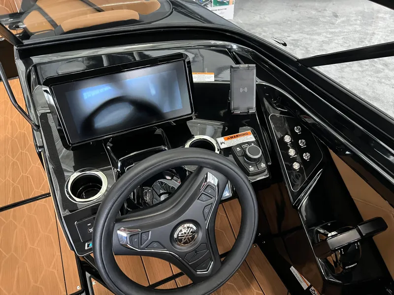 Slide: The Image of 2025 Yamaha Boats 255XD dashboard with touchscreen, steering wheel, and controls. - 10