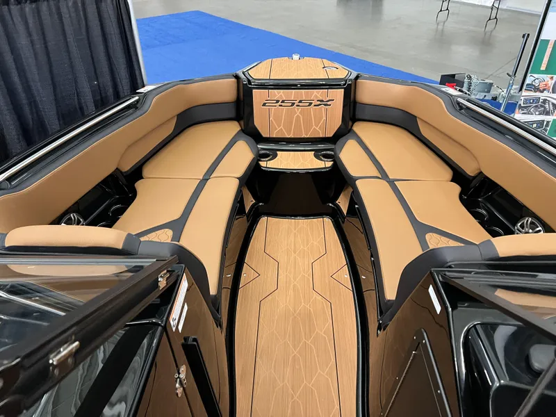Slide: The Image of 2025 Yamaha Boats 255XD interior with tan seating and sleek design. - 12