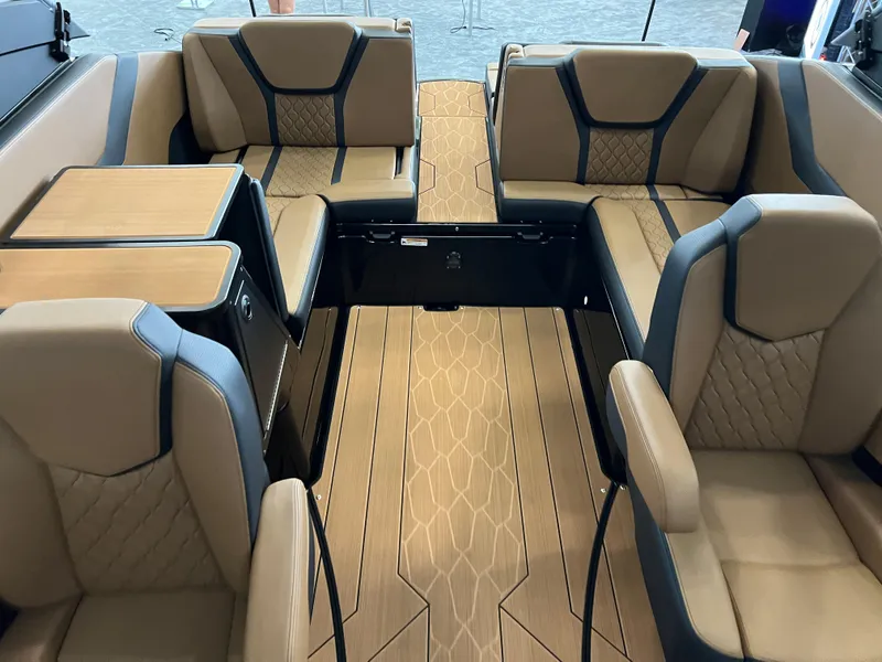 Slide: The Image of Luxurious interior of 2025 Yamaha Boats 255XD with tan seating and modern design. - 14