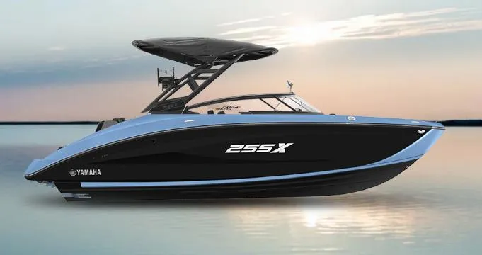 Slide: The Image of 2025 Yamaha Boats 255XD on calm water at sunset. - 15
