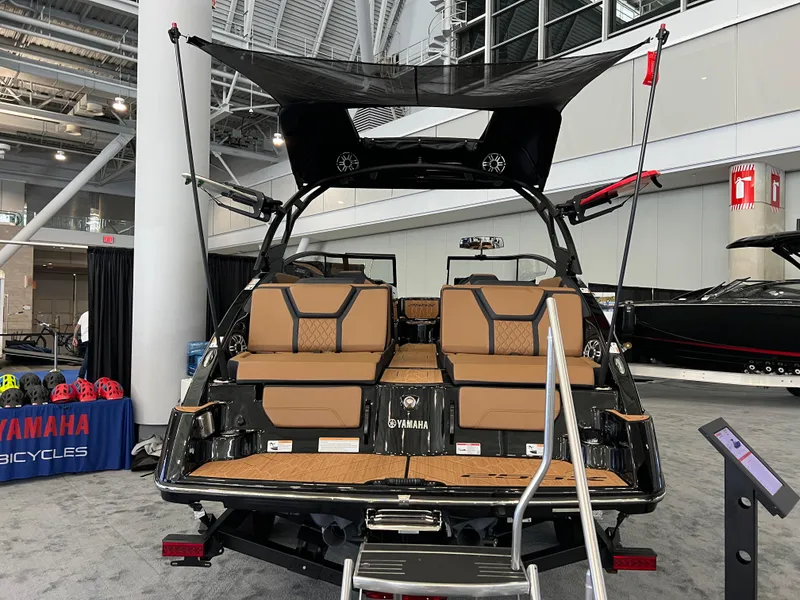 Slide: The Image of 2025 Yamaha Boats 255XD displayed at a boat show, featuring luxurious seating and modern design. - 4