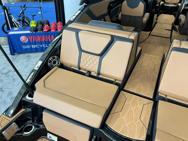Slide: The Image of 2025 Yamaha Boats 255XD interior with tan seating and modern design. - 5