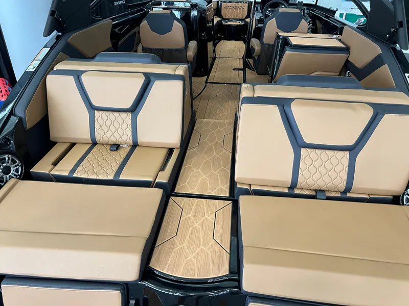 Slide: The Image of Luxurious interior of 2025 Yamaha Boats 255XD with tan and black seating. - 6
