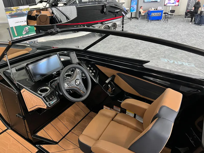 Slide: The Image of Interior of 2025 Yamaha Boats 255XD, featuring modern dashboard and luxurious seating. - 9
