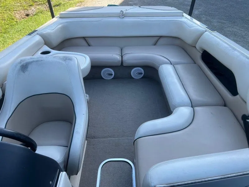 Slide: The Image of 1999 Malibu Sunsetter VLX boat interior with white leather seating and carpeted floor. - 3