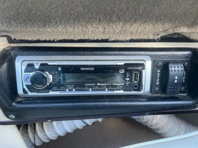 Slide: The Image of Kenwood stereo system in 1999 Malibu Sunsetter VLX boat dashboard. - 7