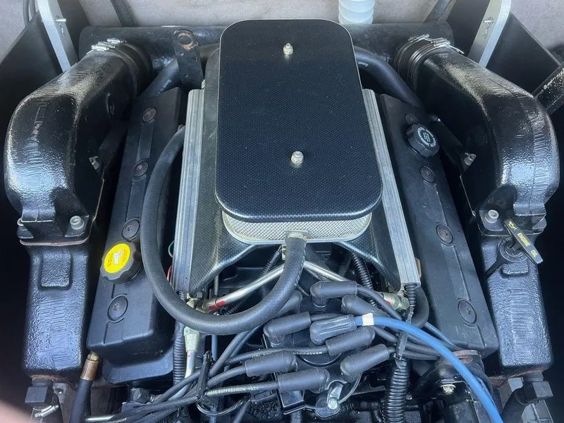 Slide: The Image of 1999 Malibu Sunsetter VLX engine, detailed view of components and wiring. - 9