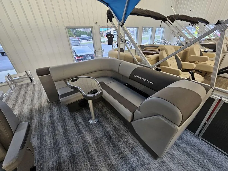 Slide: The Image of 2025 Bennington 22SLJ pontoon boat interior with gray seating and table. - 5