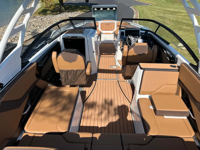 Slide: The Image of 2025 Yamaha Boats 252SD interior with luxurious seating and sleek design. - 10