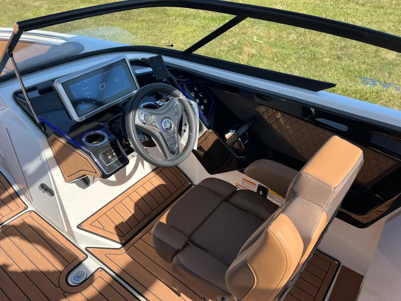 Slide: The Image of 2025 Yamaha Boats 252SD cockpit with modern dashboard and luxurious seating. - 13