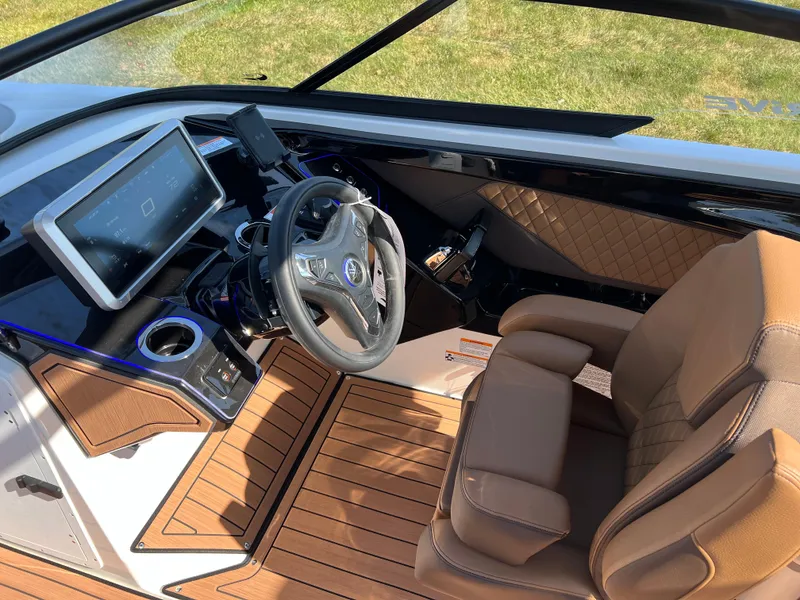 Slide: The Image of 2025 Yamaha Boats 252SD cockpit with modern dashboard and luxurious seating. - 14