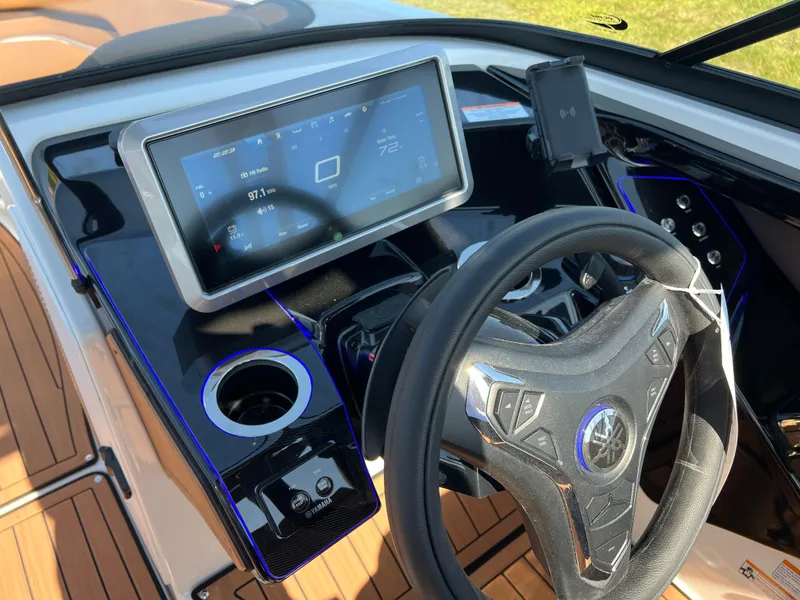 Slide: The Image of 2025 Yamaha Boats 252SD dashboard with touchscreen and steering wheel. - 15