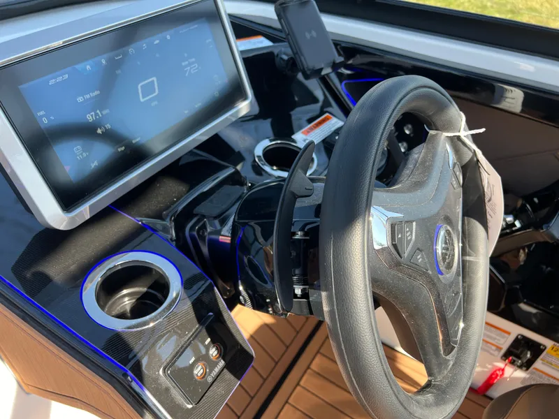 Slide: The Image of 2025 Yamaha Boats 252SD dashboard with steering wheel and digital display. - 17