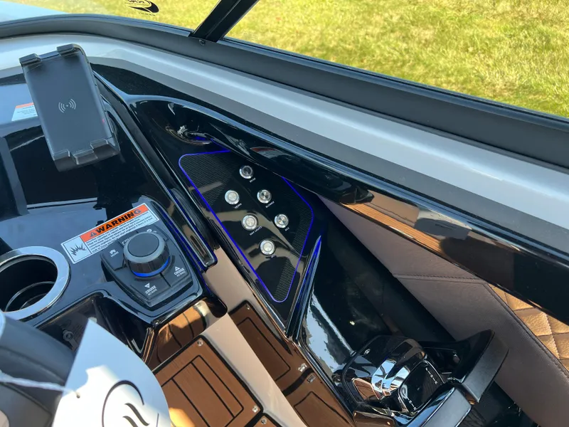 Slide: The Image of 2025 Yamaha Boats 252SD dashboard with modern controls and sleek design. - 19