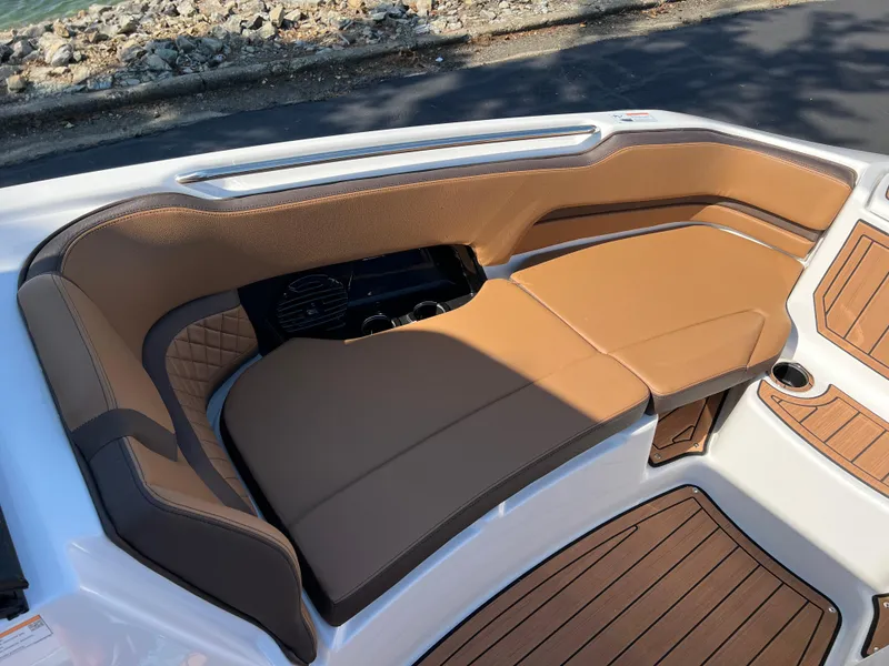 Slide: The Image of Luxurious seating on 2025 Yamaha Boats 252SD, featuring tan upholstery and sleek design. - 21