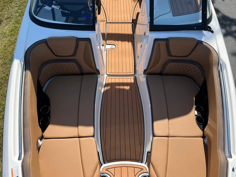 Slide: The Image of 2025 Yamaha Boats 252SD interior with tan seating and wood-style flooring. - 22