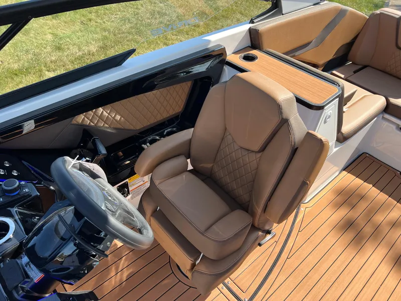 Slide: The Image of Luxurious interior of 2025 Yamaha Boats 252SD with tan leather seating and sleek design. - 26