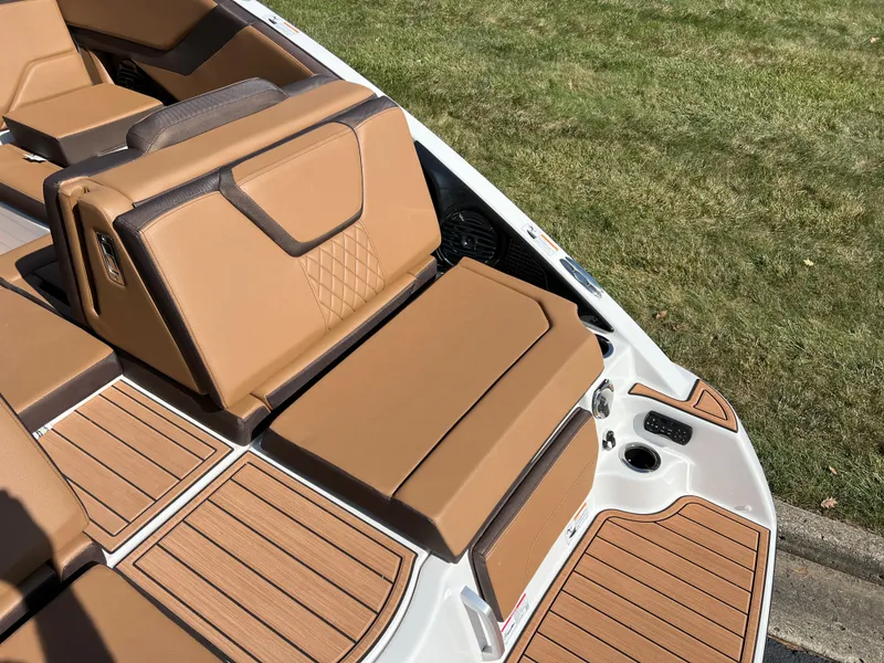 Slide: The Image of 2025 Yamaha Boats 252SD interior with tan leather seating and wood accents. - 6