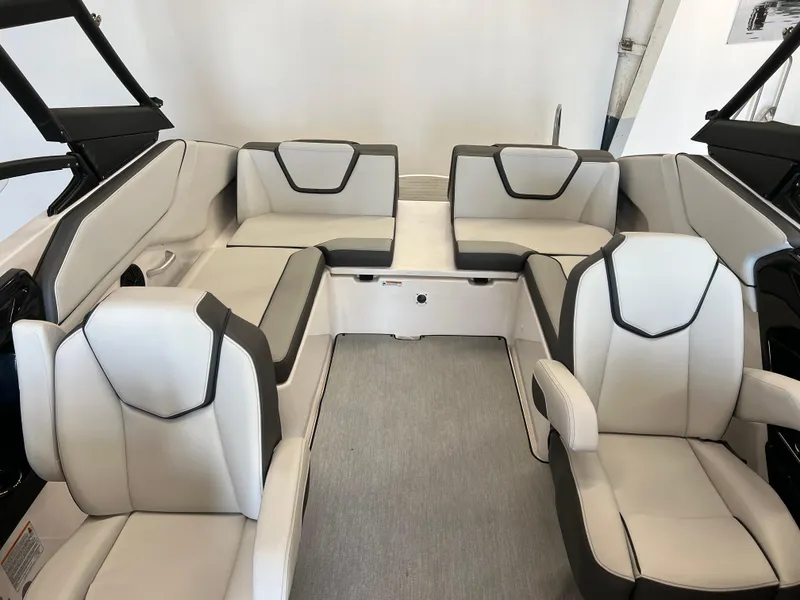 Slide: The Image of 2025 Yamaha Boats AR250 interior with modern seating and sleek design. - 13