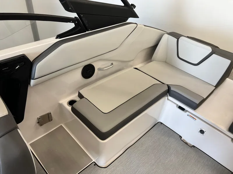 Slide: The Image of 2025 Yamaha Boats AR250 interior seating with modern design and sleek upholstery. - 14