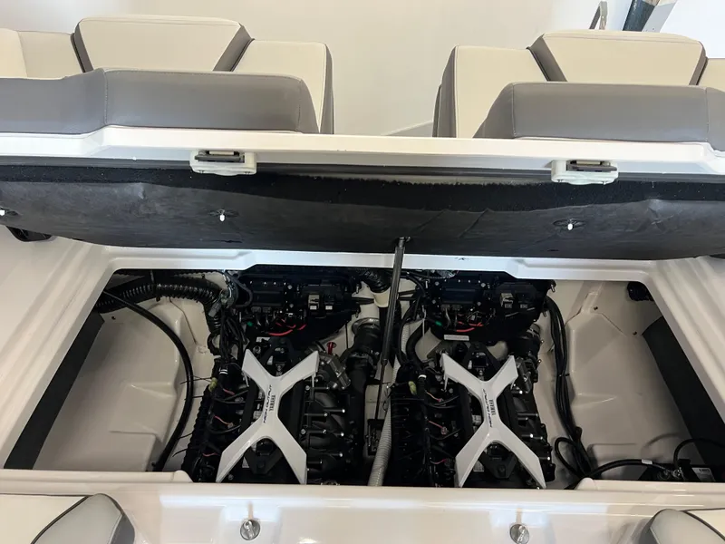 Slide: The Image of 2025 Yamaha Boats AR250 engine compartment with dual engines and seating. - 16