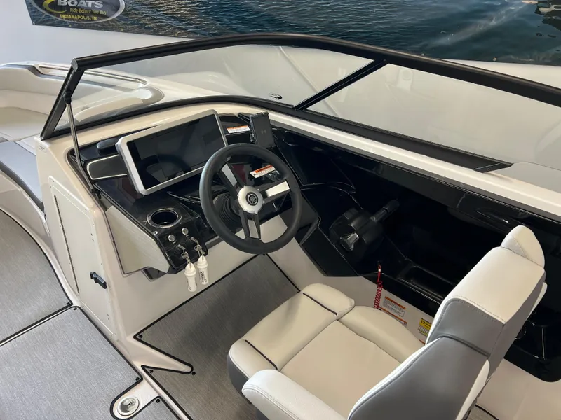 Slide: The Image of 2025 Yamaha AR250 boat interior with modern dashboard and steering wheel. - 8