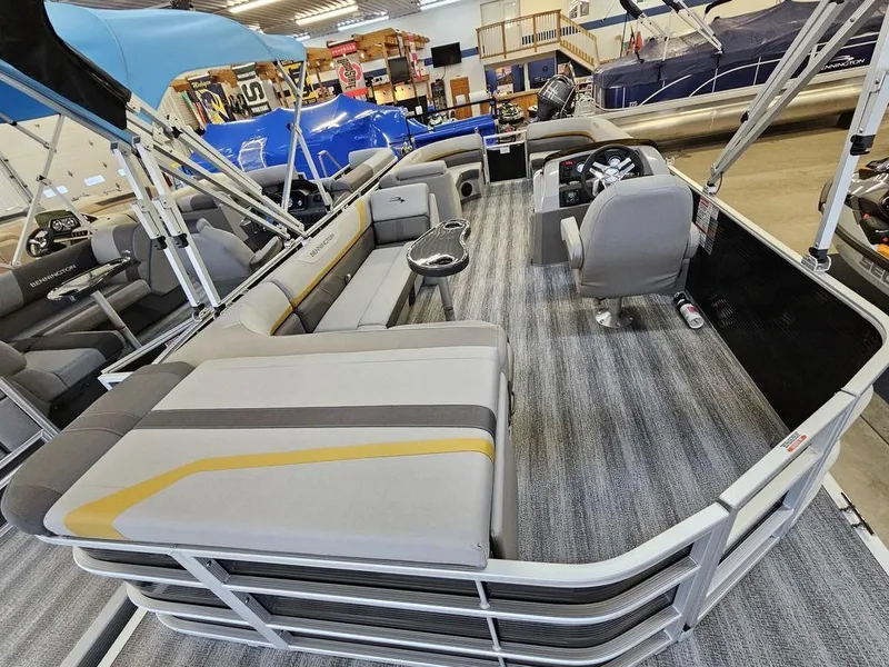 Slide: The Image of 2025 Bennington 22 SXL pontoon boat interior with spacious seating and modern design. - 6