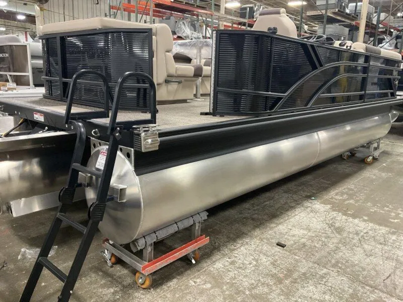 Slide: The Image of 2025 Bennington 23 SL pontoon boat in a warehouse setting. - 12