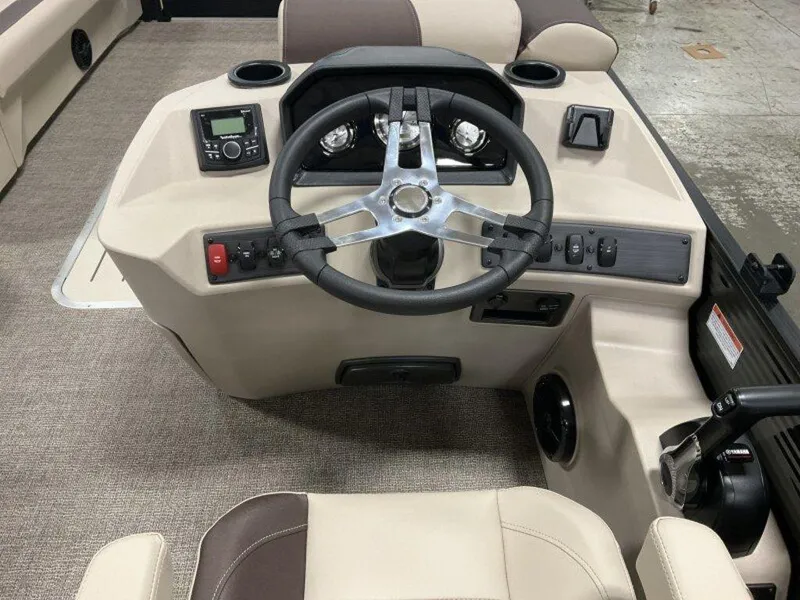Slide: The Image of 2025 Bennington 23 SL boat dashboard with steering wheel and control panel. - 8