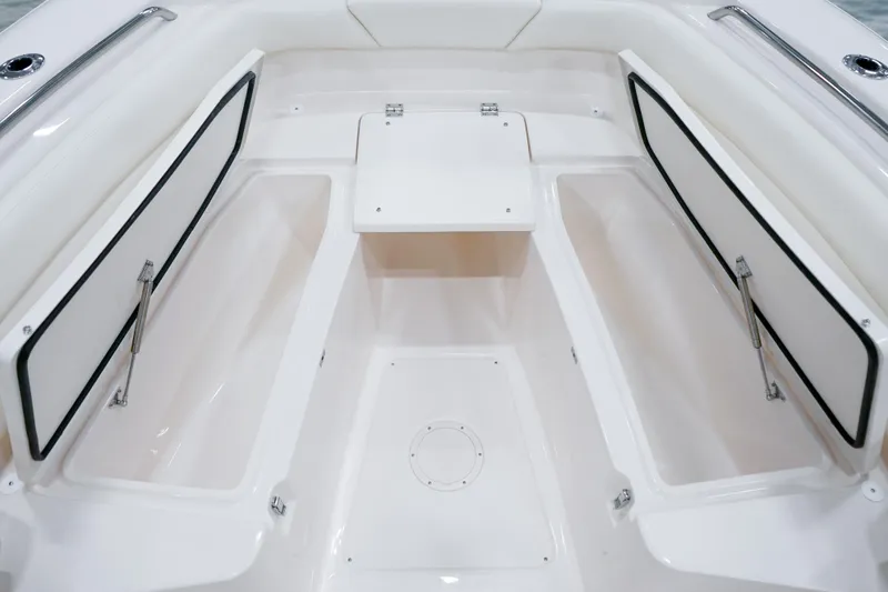 Slide: The Image of 2025 Grady-White Canyon 271 boat interior with open storage compartments. - 11