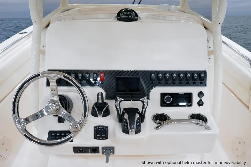 Slide: The Image of 2025 Grady-White Canyon 271 helm with advanced controls and navigation features. - 14