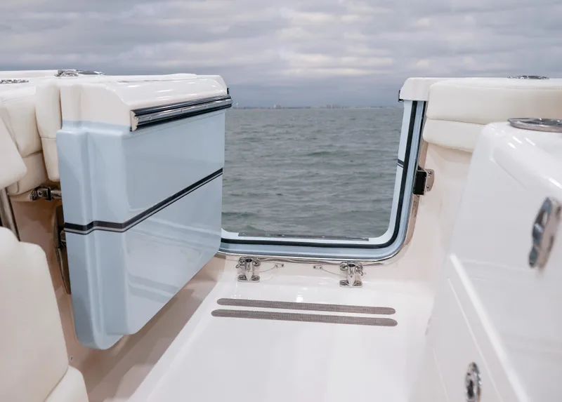 Slide: The Image of 2025 Grady-White Canyon 271 boat with open transom door, ocean view. - 15