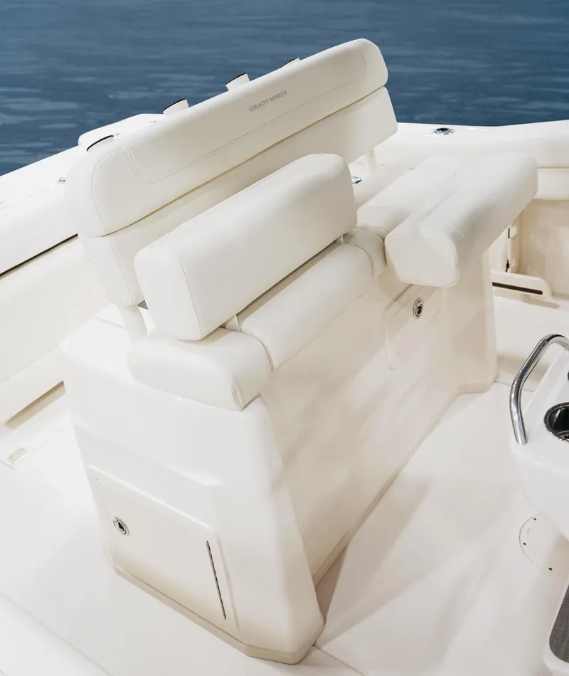 Slide: The Image of 2025 Grady-White Canyon 271 boat seating, featuring plush white upholstery and sleek design. - 8
