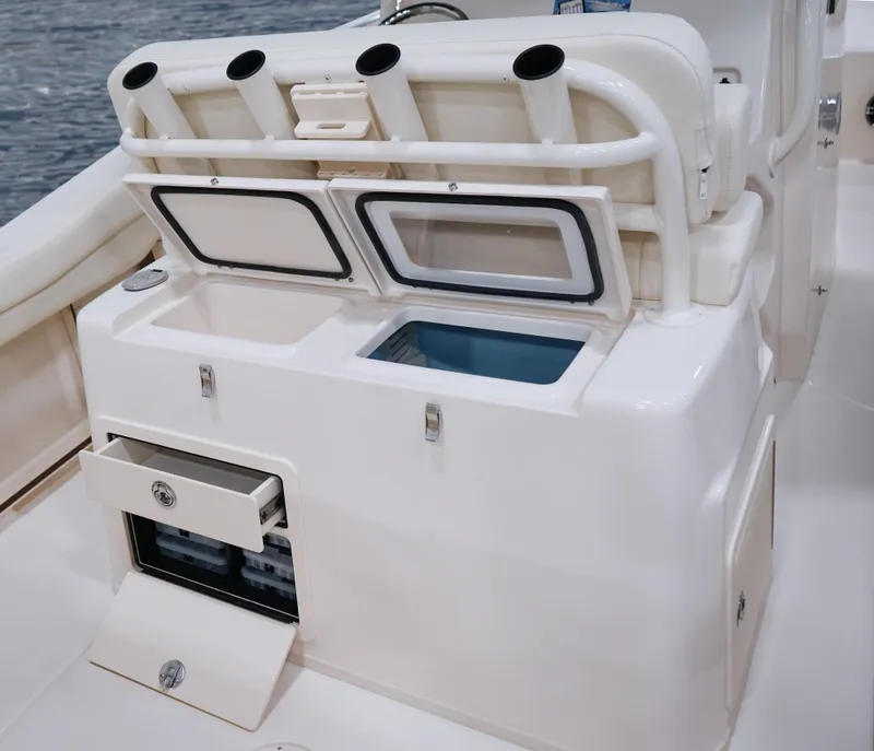 Slide: The Image of 2025 Grady-White Canyon 271 boat with storage compartments and rod holders. - 9