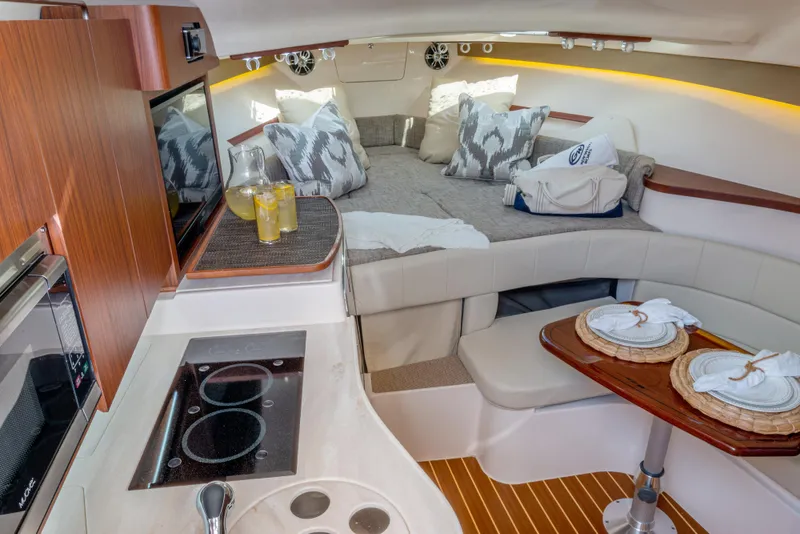 Slide: The Image of Luxurious interior of 2025 Grady-White 330 Express boat with cozy seating and modern amenities. - 13