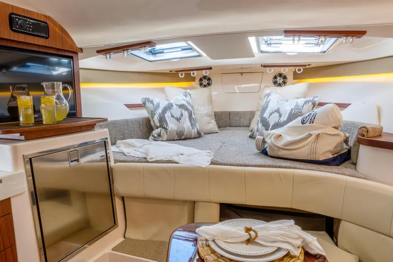 Slide: The Image of Luxurious interior of 2025 Grady-White 330 Express boat with cozy seating and modern amenities. - 14