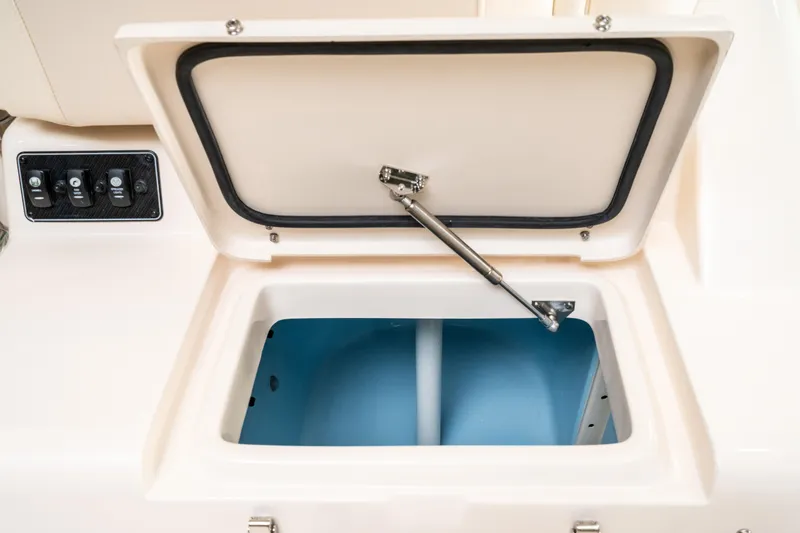 Slide: The Image of Open storage compartment on 2025 Grady-White 330 Express boat. - 5