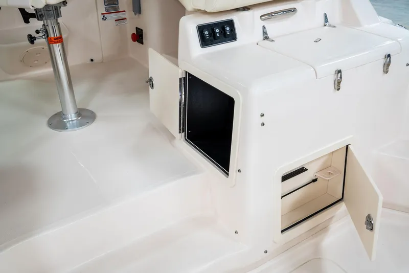 Slide: The Image of 2025 Grady-White 330 Express boat interior with open storage compartments. - 8