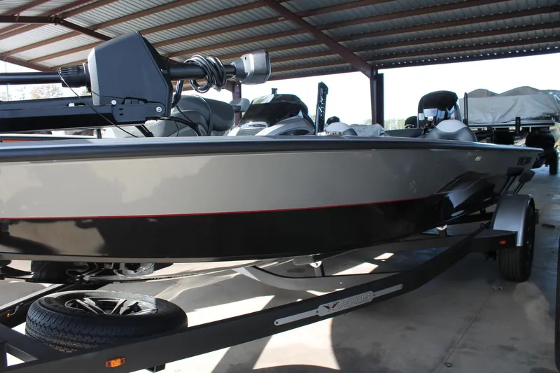 Slide: The Image of 2025 Vexus AVX1880 boat under a metal canopy, side view. - 1