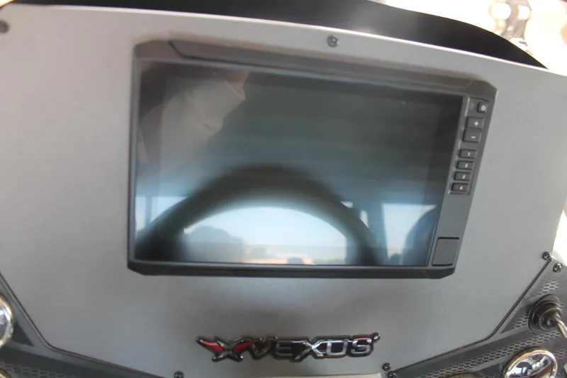 Slide: The Image of 2025 Vexus AVX1880 dashboard with digital display and controls. - 10