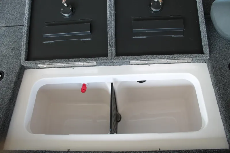 Slide: The Image of 2025 Vexus AVX1880 boat storage compartment with dual lids and spacious interior. - 11
