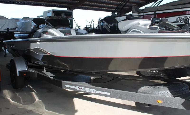 Slide: The Image of 2025 Vexus AVX1880 boat in storage, featuring sleek design and modern equipment. - 12